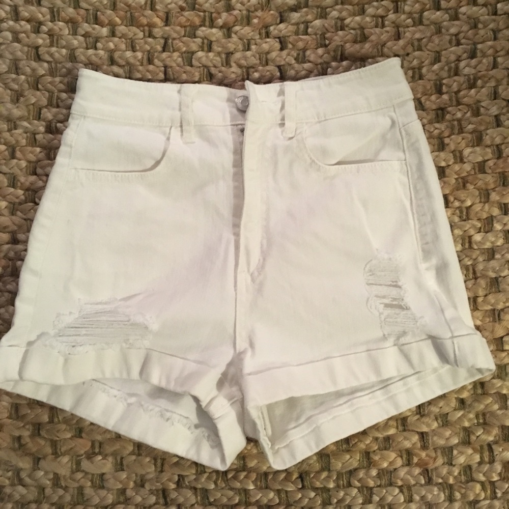 High waisted, distressed white denim shorts